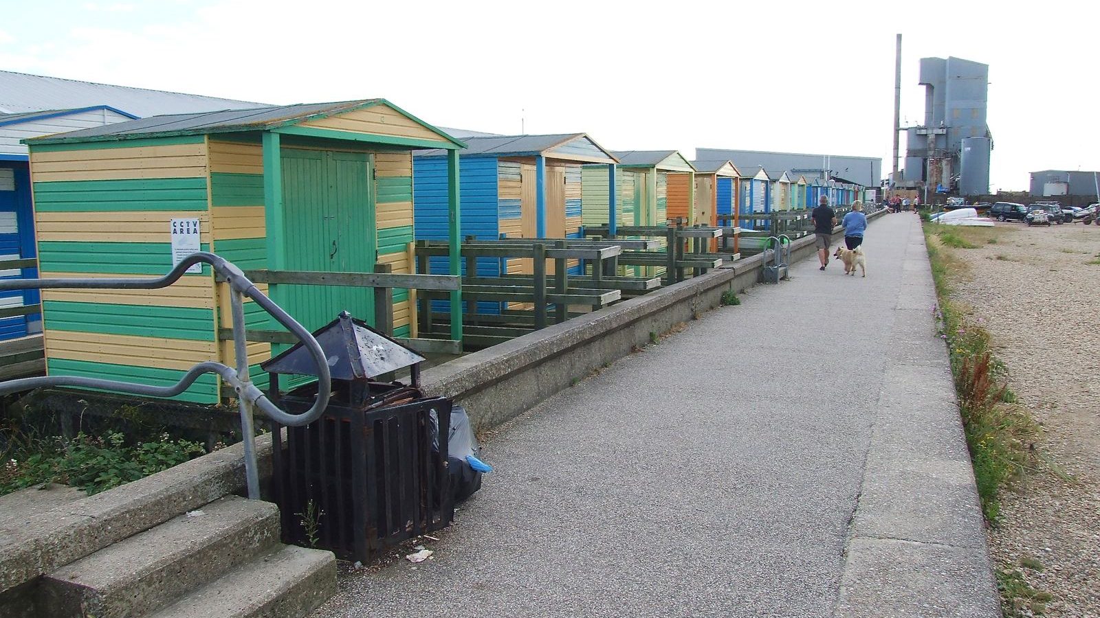 A row of brightly painted beach huts along Whitstable seafront